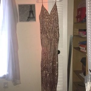 I️t is a sequin rose gold dress with straps